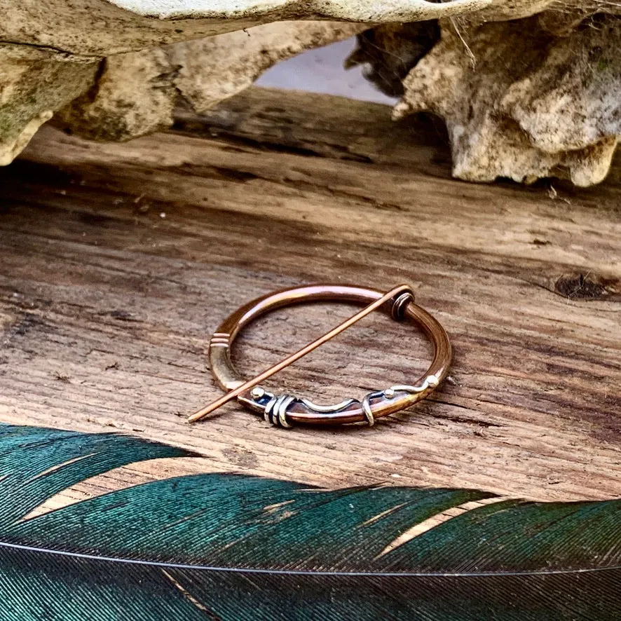 Copper and Sterling silver Pen-annular brooch.