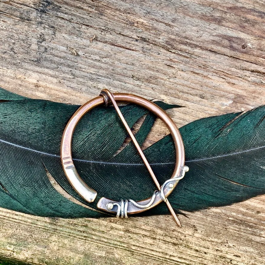 Copper and Sterling silver Pen-annular brooch.