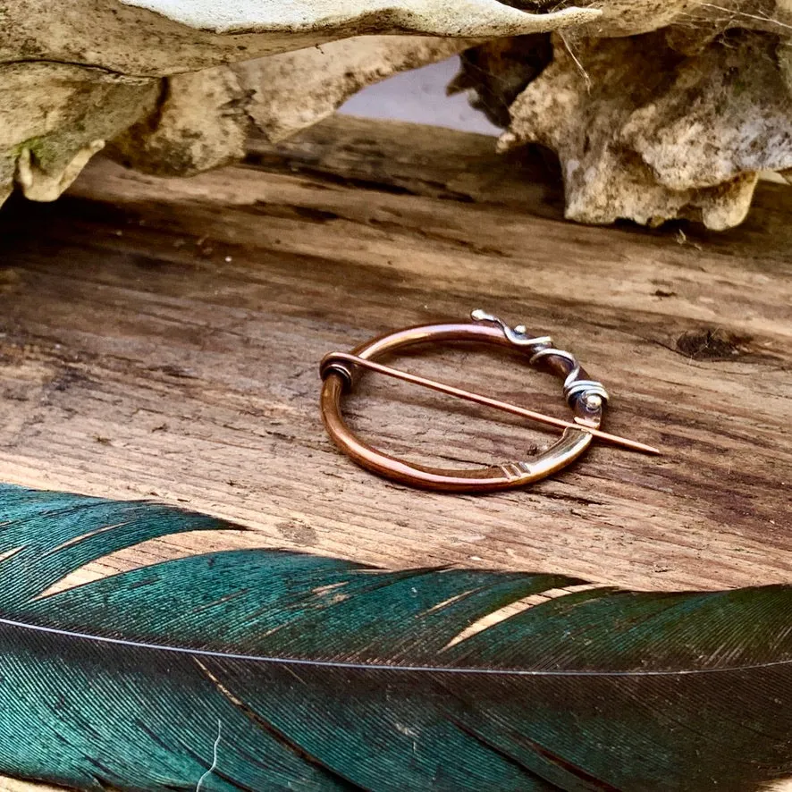 Copper and Sterling silver Pen-annular brooch.