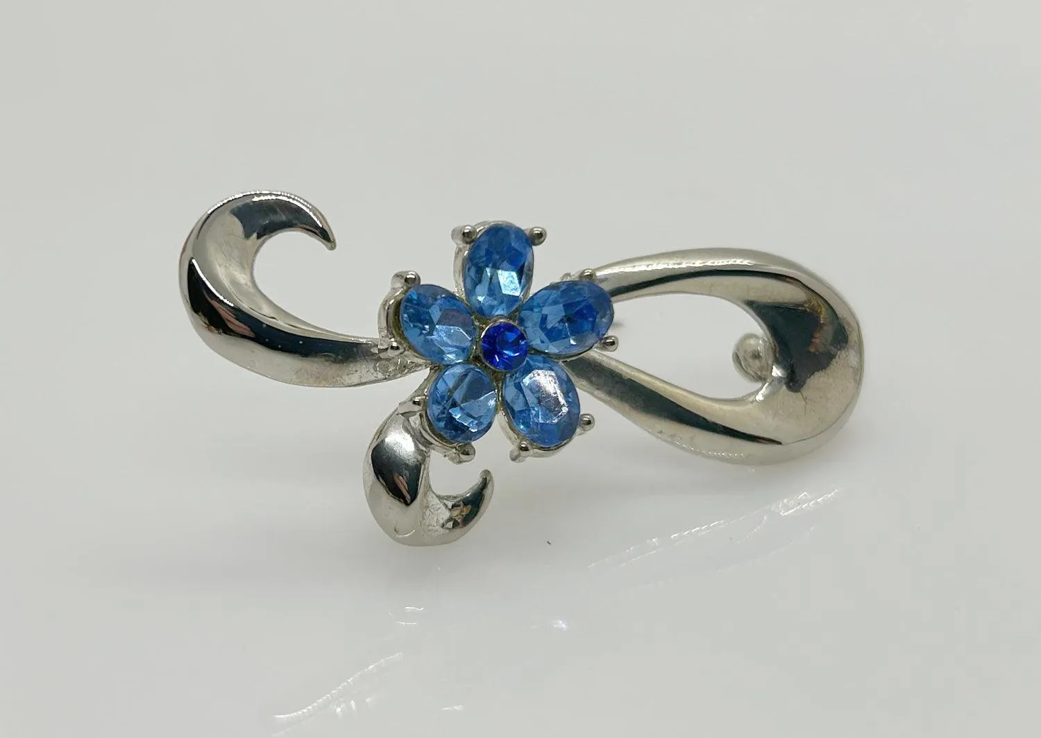 Vintage Silver Bow Brooch with Blue Stones